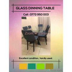 glass dining table with 6 soft cushion grey chairs - 2