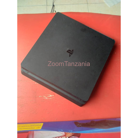 PS4 slim Tsh580,000 with 6 games and 2 controller,HDMI and charger - 2/3